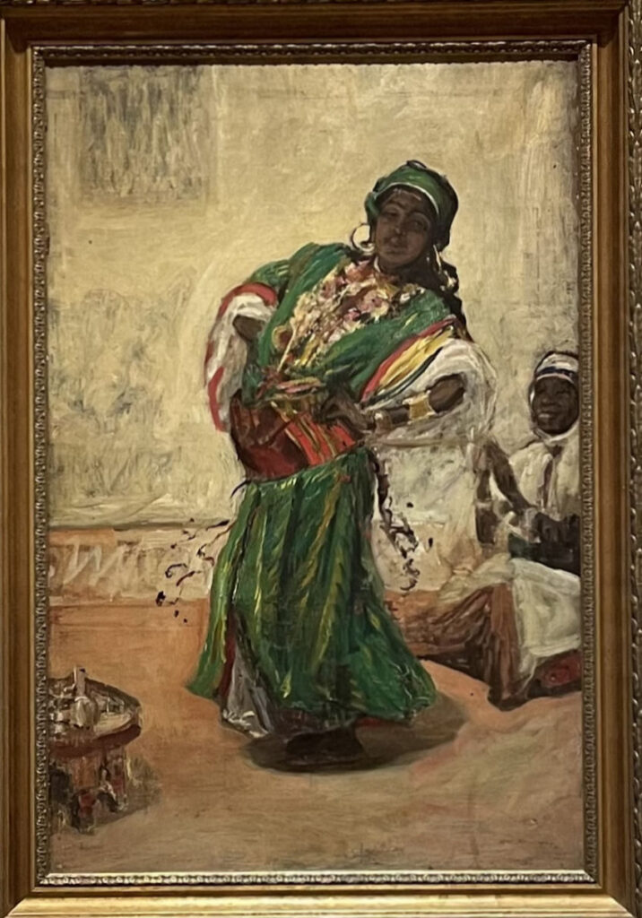 Oil painting of a Moorish dancer in flowing costume, mid-movement, set against a warm-toned interior with rich textiles and architectural details.