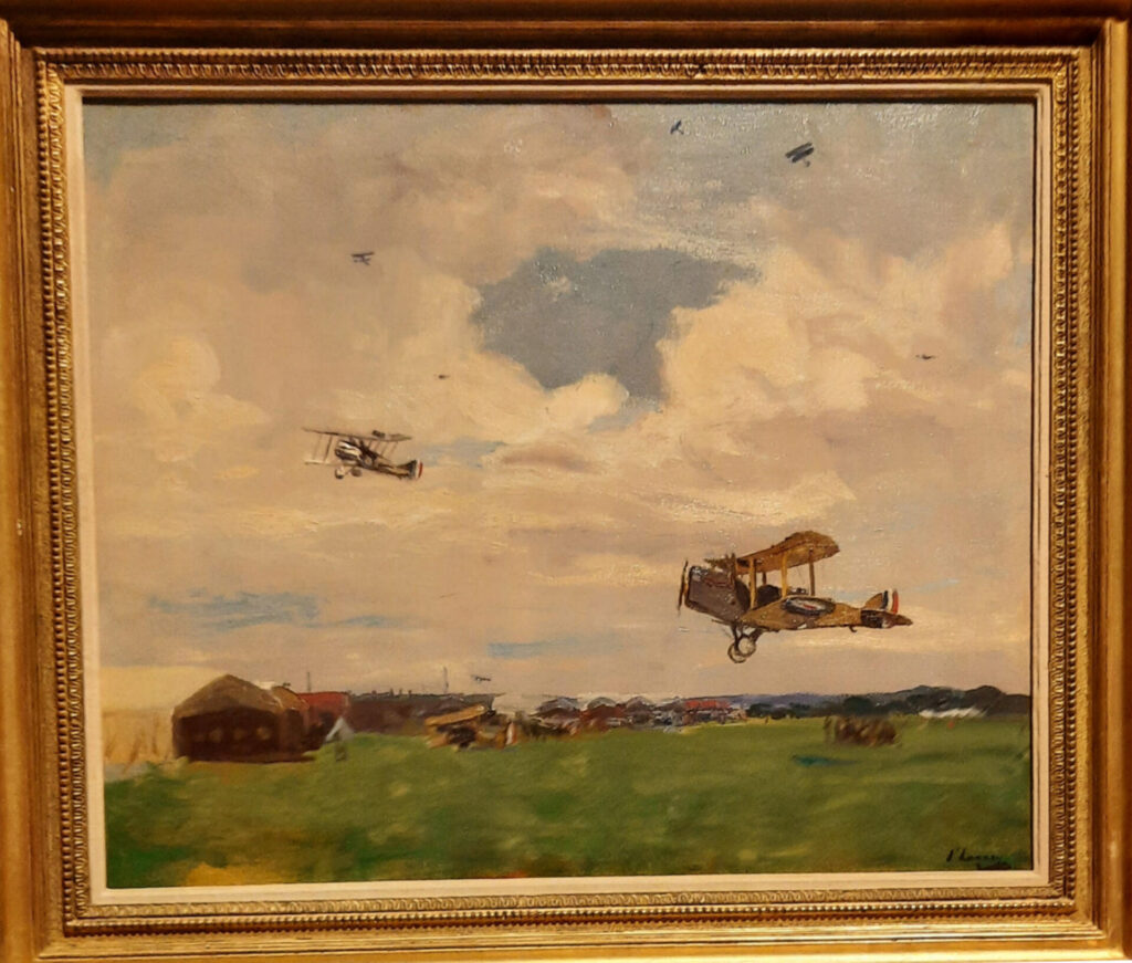 Oil painting of a World War I airfield with biplanes on the ground and personnel preparing for flight, set against a muted sky and open landscape
