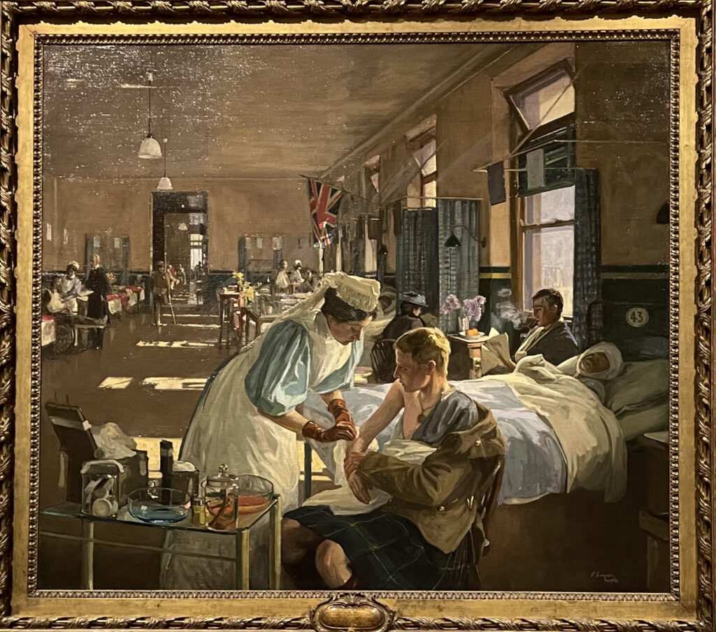 Oil painting showing wounded soldiers lying in hospital beds, attended by nurses and doctors in a softly lit ward at London Hospital during World War I.