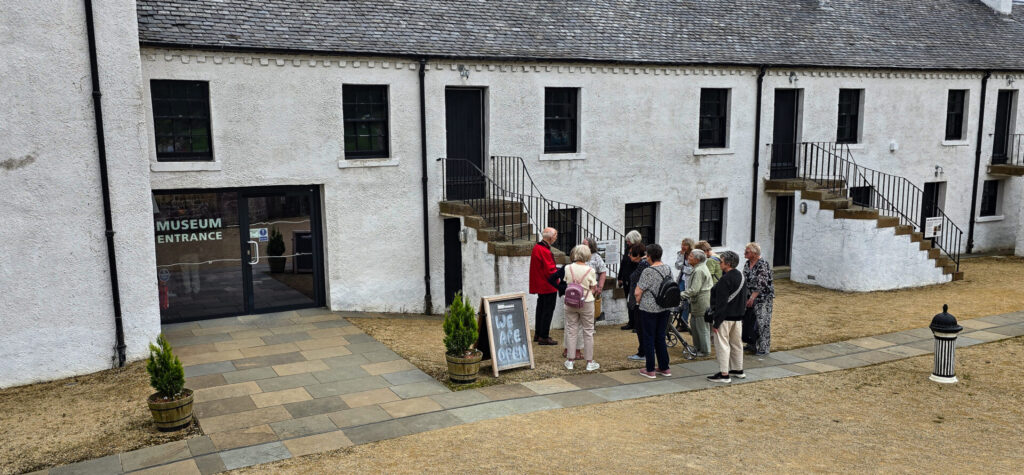 mebers waiting at the museum for the tour